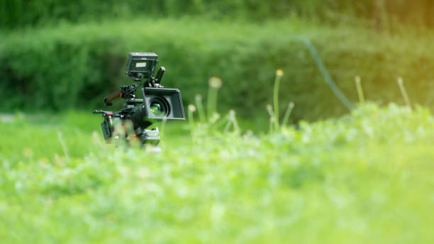 istock Camera taking pictures and recording video on the lawn. 1329690849