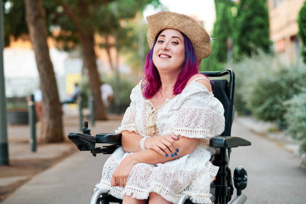 portrait of adult woman with disabiliites looking at camera portrait of adult woman with disabiliites looking at camera disability stock pictures, royalty-free photos & images