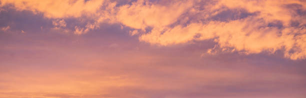 istock Sunset clouds in beautiful colours. Colorful clouds. Sun and cloud background with a pastel colored 1329694732