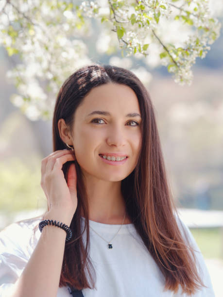 istock Young smiling brunette woman outdoors portrait. 1329694838