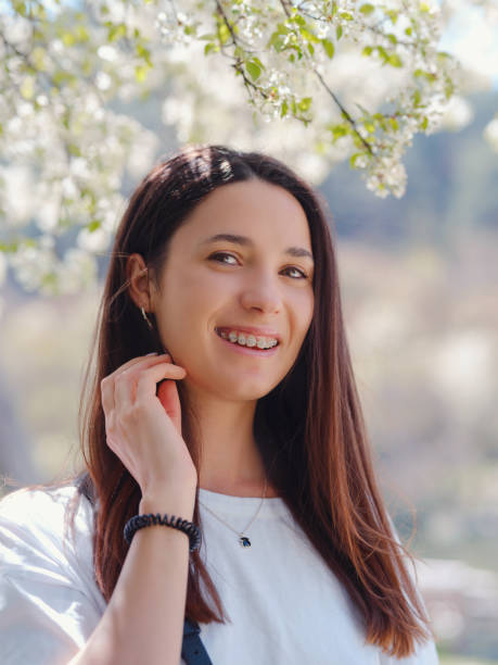 istock Young smiling brunette woman outdoors portrait. 1329695703