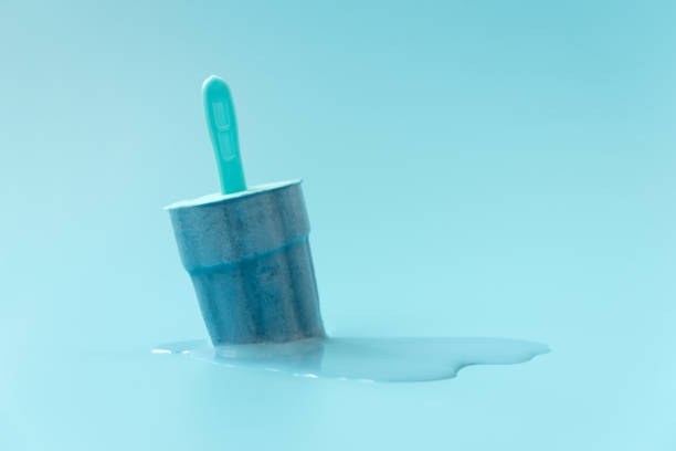 istock Melted ice cream on blue background.  Creative summer food concept 1329696652