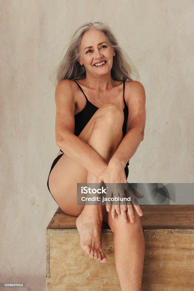 Cheerful Mature Woman Posing In Her Natural Body Stock Photo - Download  Image Now - Mature Women, Senior Women, Underwear - iStock