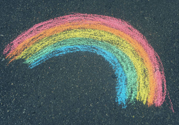 istock Children's drawing of a rainbow on the asphalt with crayons 1329697196
