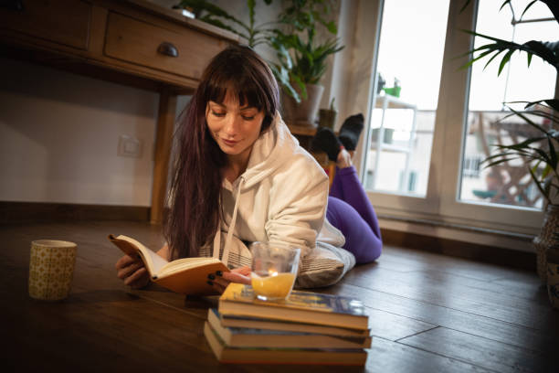 istock Young women relaxing carefree reading 1329697987