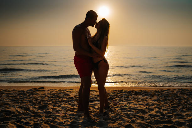 istock Young couple sharing love on summer vacation 1329698342