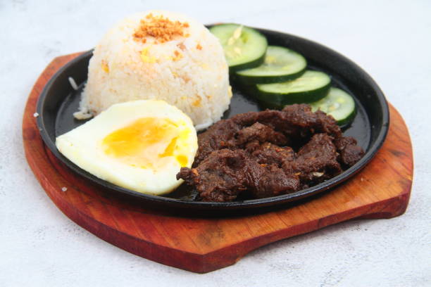 Freshly cooked Filipino meal called Tapsilog stock photo
