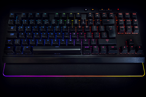 RGB backlit gaming keyboard with rainbow colors and RGB mousemat