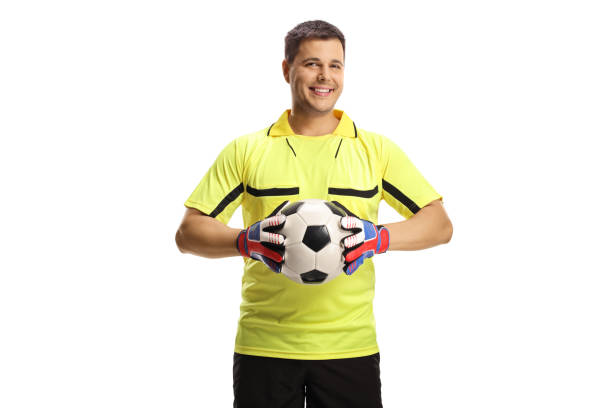 istock Goalkeeper holding a ball and smiling 1329703468