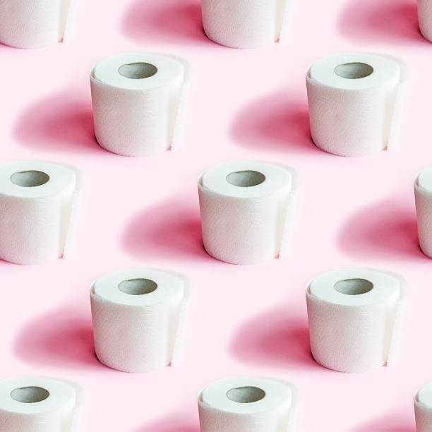 istock White toilet paper roll repeat seamless pattern on light pink background 1329703643