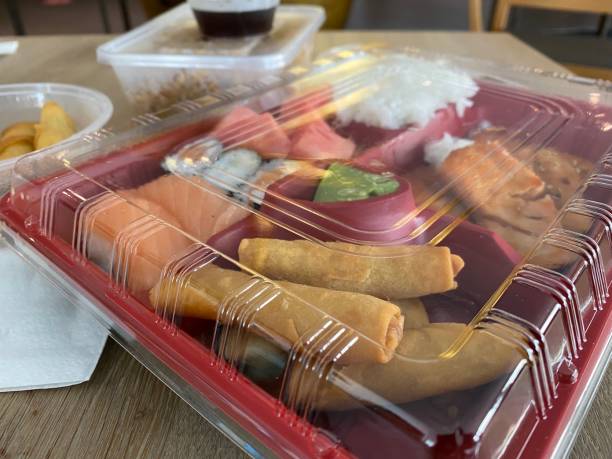 istock Sushi and spring rolls packed in plastic box to go during corona Covid-19 time 1329704547