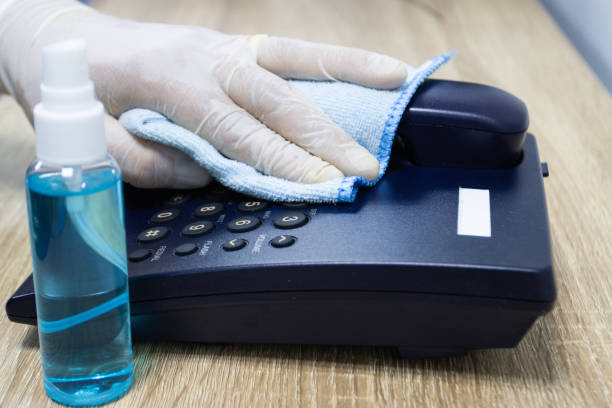 istock Concept Prevention cleaning frequently, Focus on the high traffic areas that enable pathogens to spread around the telephone equipment such Phone button 1329707321