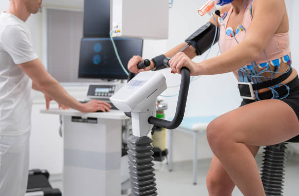 istock Female Athlete Performing ECG and VO2 test on Indoor Bicycle 1329707344