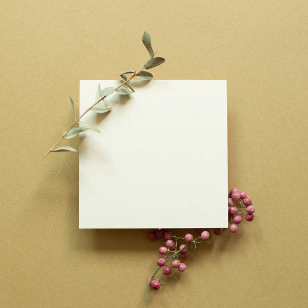istock White memo pad with eucalyptus leaf and red fruit on brown background. top view, copy space 1329711508