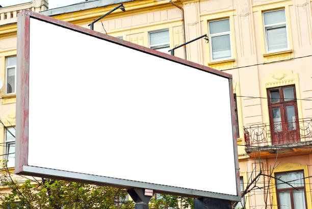 istock Blank billboard on house background. Old architecture in the background. Copy space and space for text. Mockup for design. Blank template for advertising. 1329716148