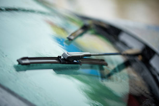 istock Working windshield wiper of a car from raindrops. 1329717462
