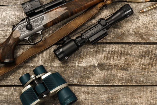 istock Various hunting equipment on old wooden background 1329721224