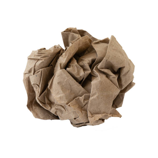 istock crumpled brown paper ball on white background 1329722266