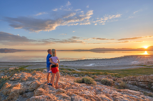 Mother, Father, and Daughter Enjoying the Breathtaking Sunrise in the Beautiful 
Antelope Island State Park Near Salt Lake City, UTAH USA