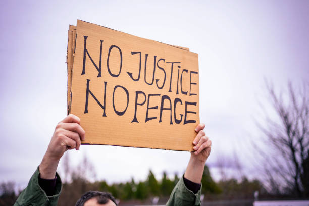 istock Man protesting at the street 1329727387