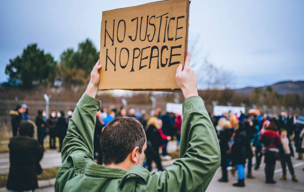 istock Man protesting at the street 1329728380