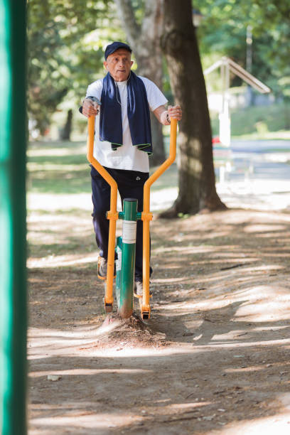 istock Senior man at outdoor gym 1329729297