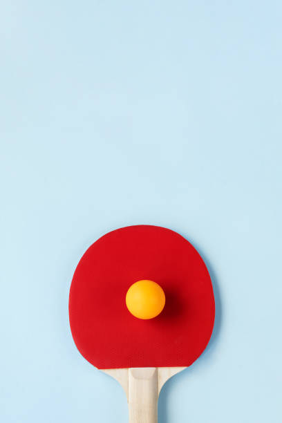 istock Top view of red ping pong paddle and ball 1329730882