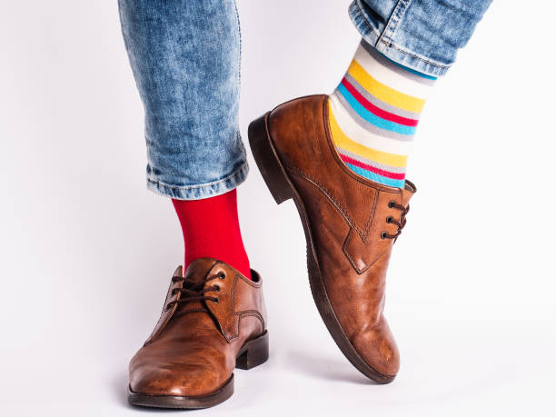 istock Men's legs, trendy shoes and bright socks 1329732789