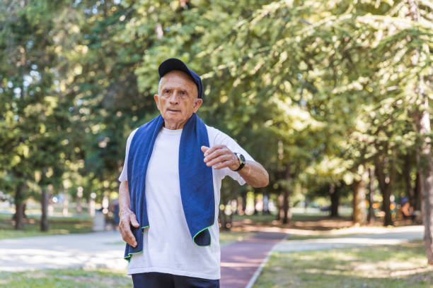 istock Tired mature man jogging 1329734244