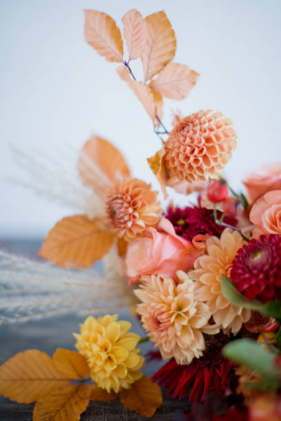 istock Autumn bouquet with orange red flowers 1329736665