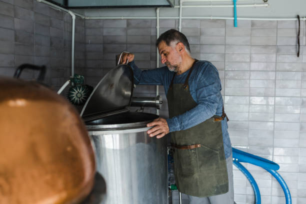 istock man in mini craft brewery 1329742159