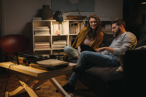 istock friends couple at home 1329745069