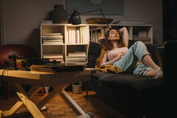 istock woman relaxing at home 1329745108