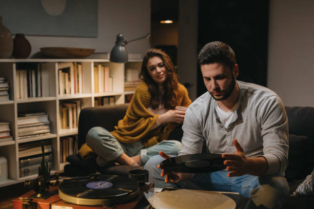istock friends couple at home 1329745172