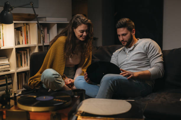 istock friends couple at home 1329745269