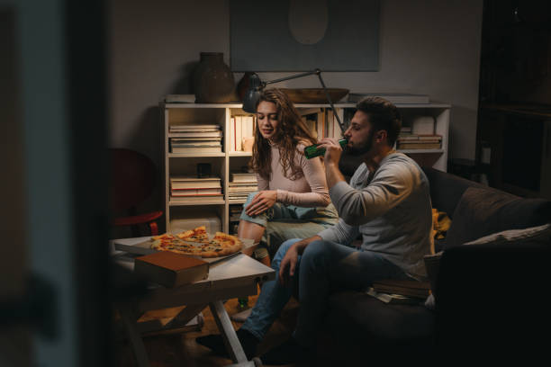 istock friends couple at home 1329745401