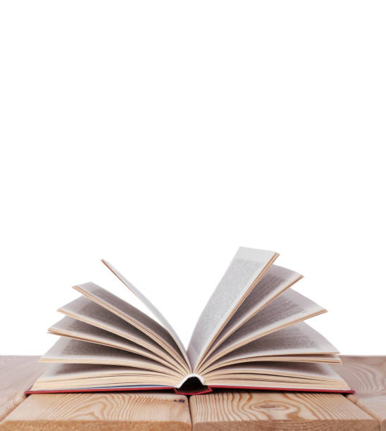 istock Isilated open book on the wood table 1329751105