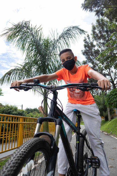 istock latin boy with his mountain bike 1329753368