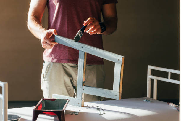 istock Anonymous Man Painting Furniture 1329755937