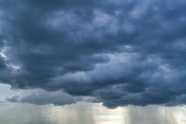 Dark storm clouds gathering on the sky before summer storm.