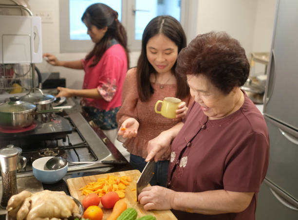 istock grandmother preparing reunion dinner for chinese New year 1329760064
