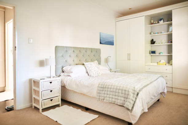 istock Comfortable bed with side tables in a contemporary home 1329761222