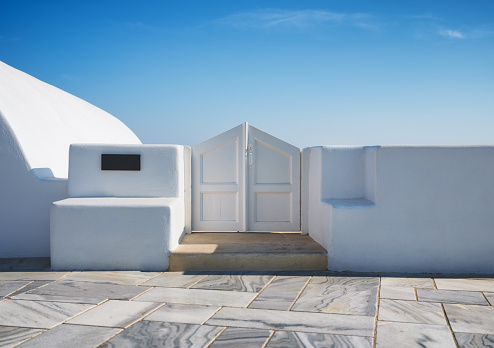 Traditional courtyard entrance in the village of Oia, Santorini, Greece. Traditional architecture. Photo as wallpaper.
