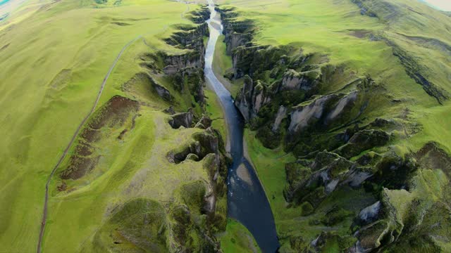 DRONE POV of isolated, Icelandic extravagant river formation