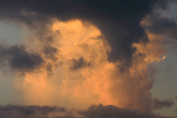 istock Beautiful clouds with orange and golden light, dramatic sky by by the sunrise. 1329764330