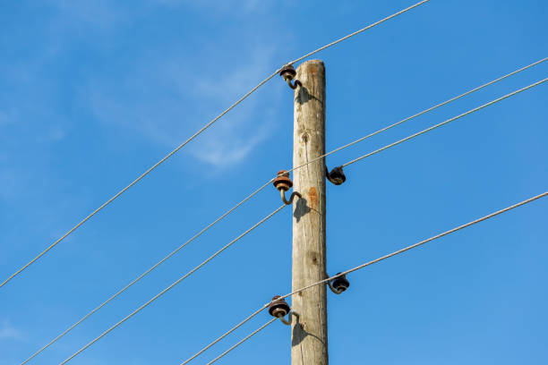 istock A wooden power line pole and steel electrical cables 1329765100