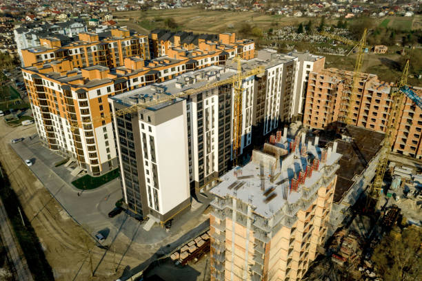 istock Construction and construction of high-rise buildings, the construction industry with working equipment and workers. View from above, from above. Background and texture 1329769522