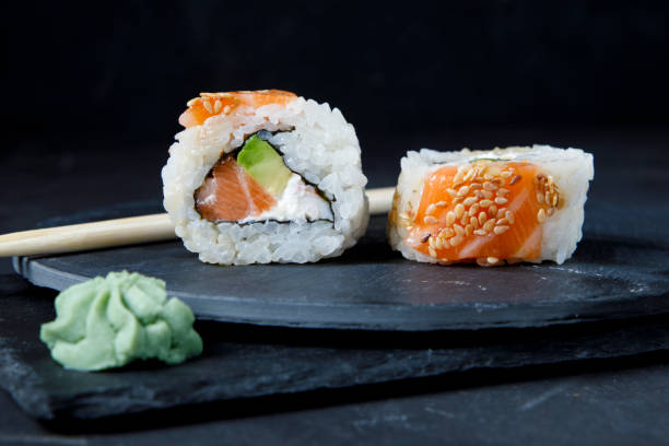 istock Gourmet sushi on black background 1329775657