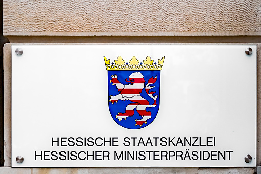 Wiesbaden, Germany - December 8, 2020: signage Hessian State Chancellery Hessian Prime Minister - deutsch: state chancellery Hesse cancellor - at the cancellery in Wiesbaden, Germany.