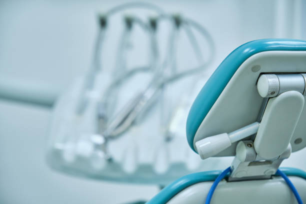 istock empty seat of a dental clinic with unfocused background instruments 1329777424